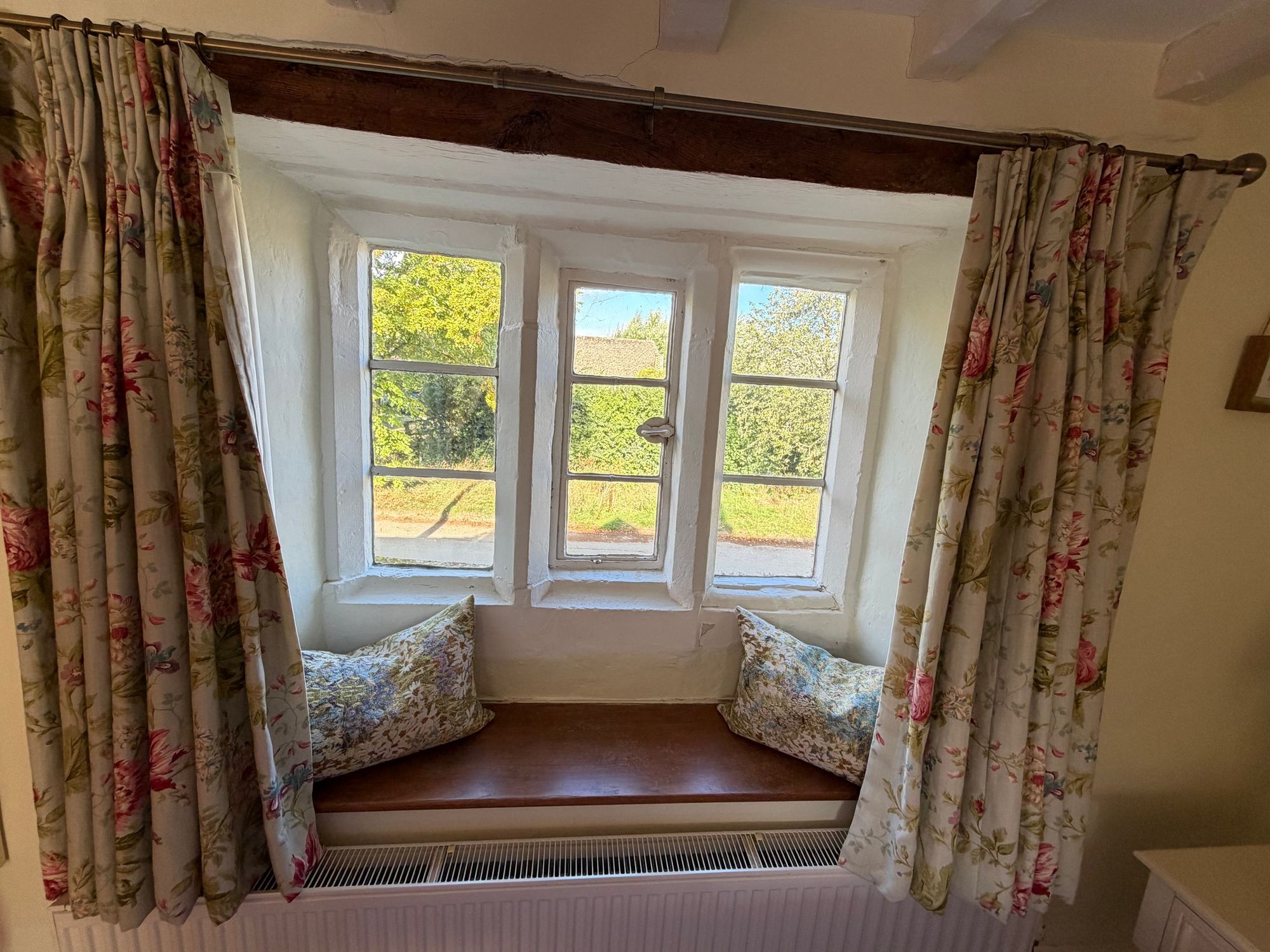 Bay window seat with countryside views at Glebe Cottage, Bledington