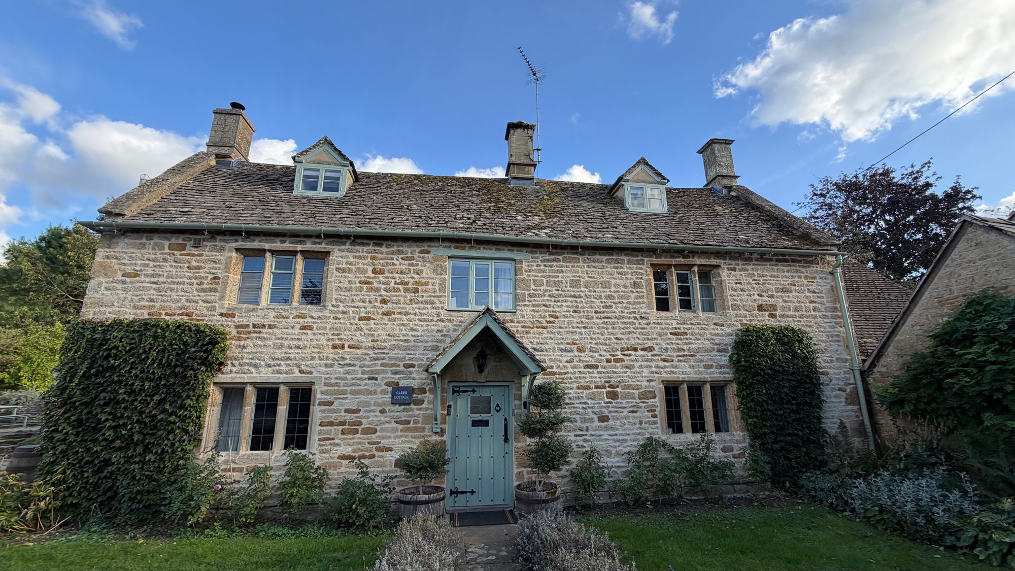 The restored stone front of Glebe Cottage, repointed by Russet and Sage