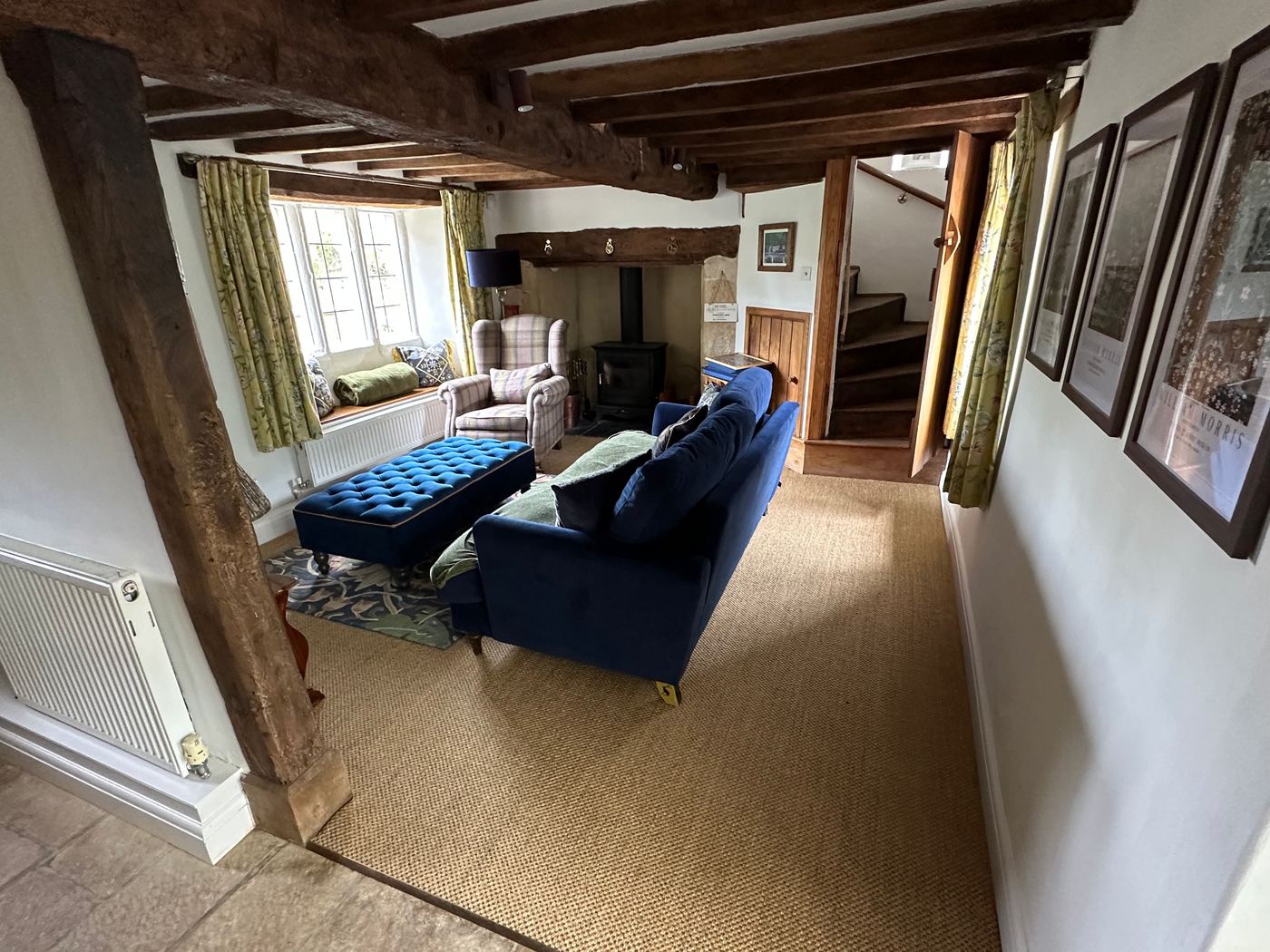 Snug with inglenook fireplace at Glebe Cottage, Bledington